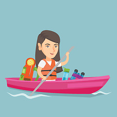 Image showing Young caucasian woman riding a kayak.