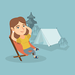 Image showing Woman sitting in a folding chair in the camping.