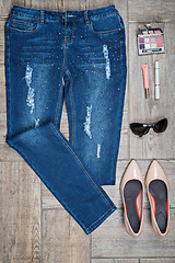 Image showing Aerial view of woman\'s jeans and accessories