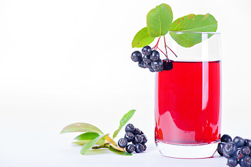 Image showing Glass of aronia juice with berries