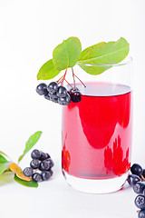 Image showing Glass of aronia juice with berries