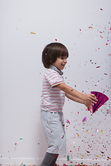 Image showing kid blowing confetti