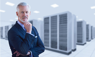 Image showing Senior businessman in server room