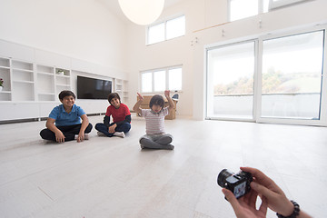 Image showing young boys having fun on the floor