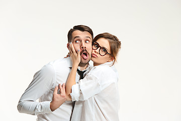 Image showing The business man and woman communicating on a gray background