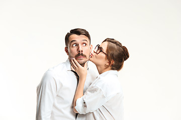 Image showing The business man and woman communicating on a gray background