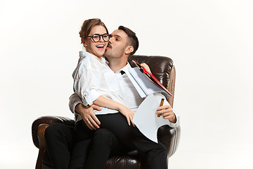 Image showing The business man and woman communicating on a gray background