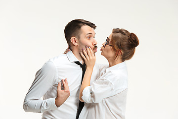 Image showing The business man and woman communicating on a gray background