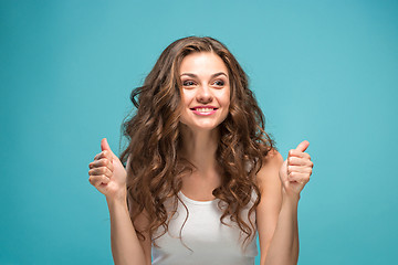 Image showing The young woman\'s portrait with happy emotions