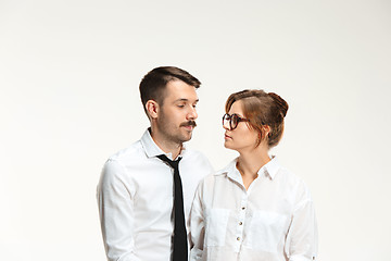 Image showing The business man and woman communicating on a gray background