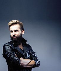 Image showing portrait of young bearded hipster guy on gray dark background close up, brutal modern man, lifestyle people concept 