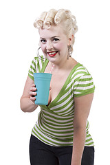 Image showing Woman in pin-up dress drinking - Isolated