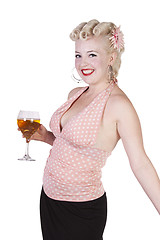 Image showing Woman in pin-up dress drinking - Isolated