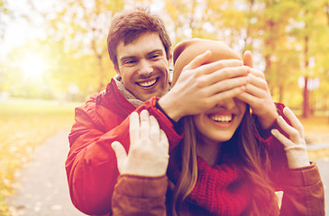 Image showing happy young couple having fun in autumn park