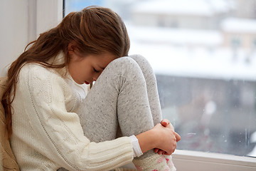 Image showing beautiful sad girl at home