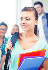 Image showing student girl with school bag and color folders