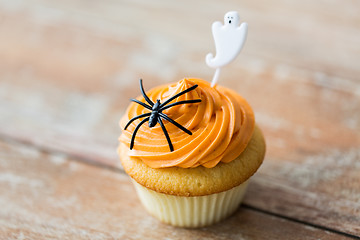 Image showing cupcake with halloween decoration on table