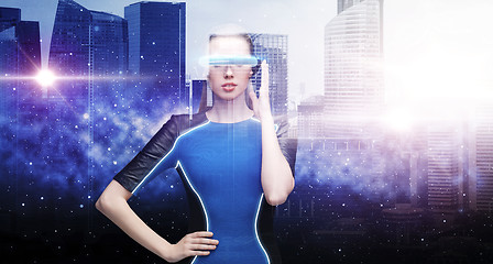 Image showing woman in virtual reality glasses over space city