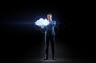 Image showing businessman working with virtual cloud hologram