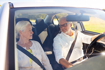 Image showing happy senior couple driving in car