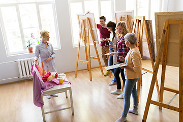 Image showing students and teacher with still life at art school