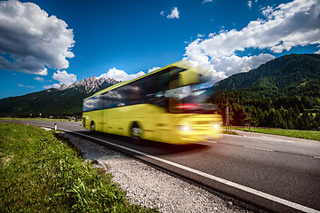 Image showing Yellow Public bus traveling on the road