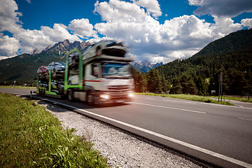 Image showing Truck trailer transports new cars rides on highway