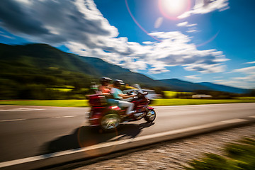 Image showing Tricycle Blurred motion Bikers on the road