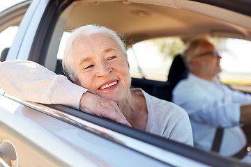 Image showing happy senior couple driving in car