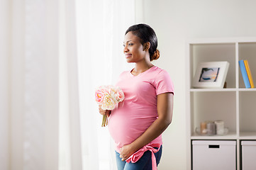 Image showing happy african american pregnant woman with flowers