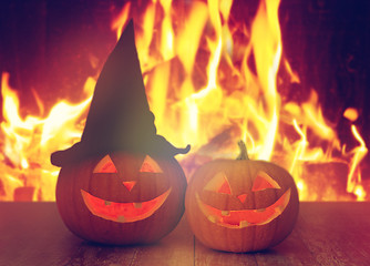 Image showing carved halloween pumpkins on table over fire