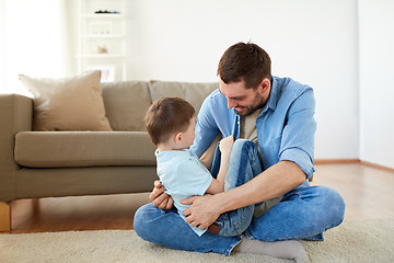 Image showing father with son playing and having fun at home