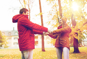 Image showing happy young couple having fun in autumn park