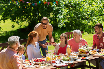 Image showing happy family having dinner or summer garden party