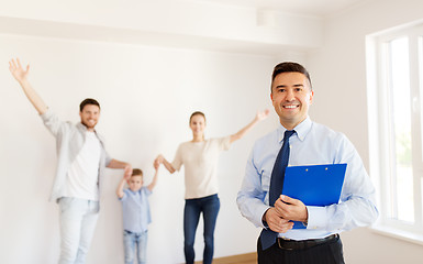 Image showing realtor with clipboard and family at new home