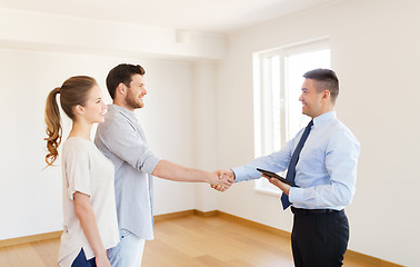 Image showing man and realtor shaking hands at new home