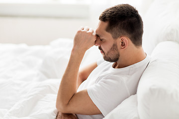 Image showing stressed man in bed at home