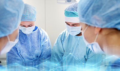 Image showing group of surgeons in operating room at hospital