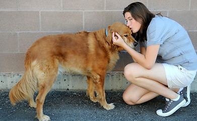 Image showing Female and dog bonding.