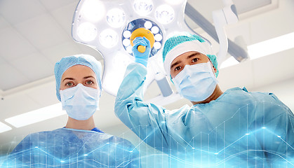 Image showing group of surgeons in operating room at hospital