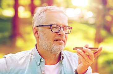 Image showing old man using voice command recorder on smartphone