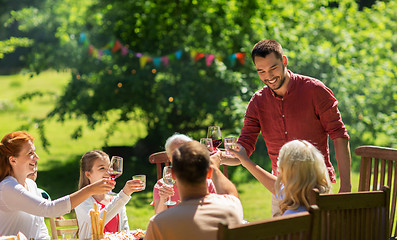 Image showing happy family having dinner or summer garden party