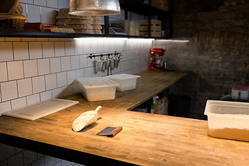 Image showing dough and baking tools on bakery kitchen table