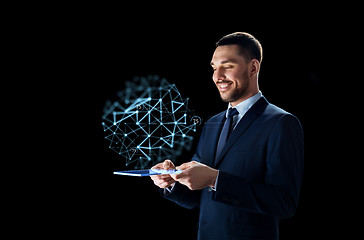 Image showing businessman with tablet pc and low poly projection