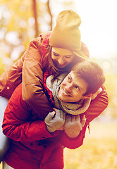 Image showing happy young couple having fun in autumn park