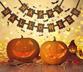 Image showing carved pumpkins and happy halloween garland