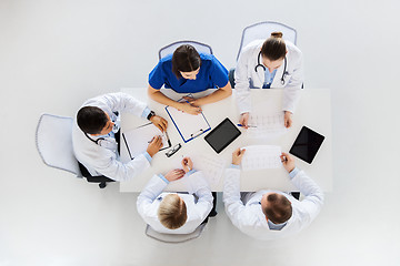 Image showing group of doctors with cardiograms at hospital