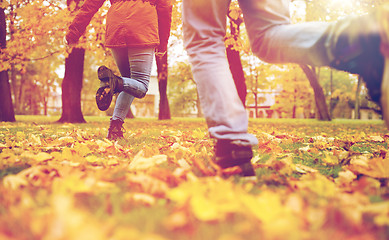 Image showing young couple running in autumn park