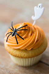Image showing cupcake with halloween decoration on table