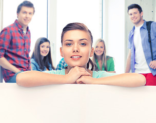 Image showing woman with white blank board at school